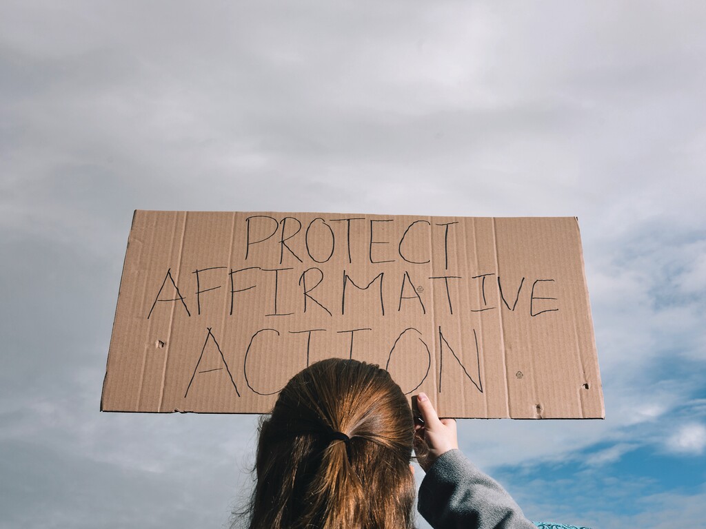 BC-OPINION-SCHEINDLIN-AFFIRMATIVE-ACTION-ART-NYTSF — A protester, seen from behind, holds a cardboard sign reading “Protect Affirmative Action.” (Christopher Lee for The New York Times) — ONLY FOR USE WITH ARTICLE SLUGGED — BC-OPINION-SCHEINDLIN-AFFIRMATIVE-ACTION-ART-NYTSF — OTHER USE PROHIBITED.