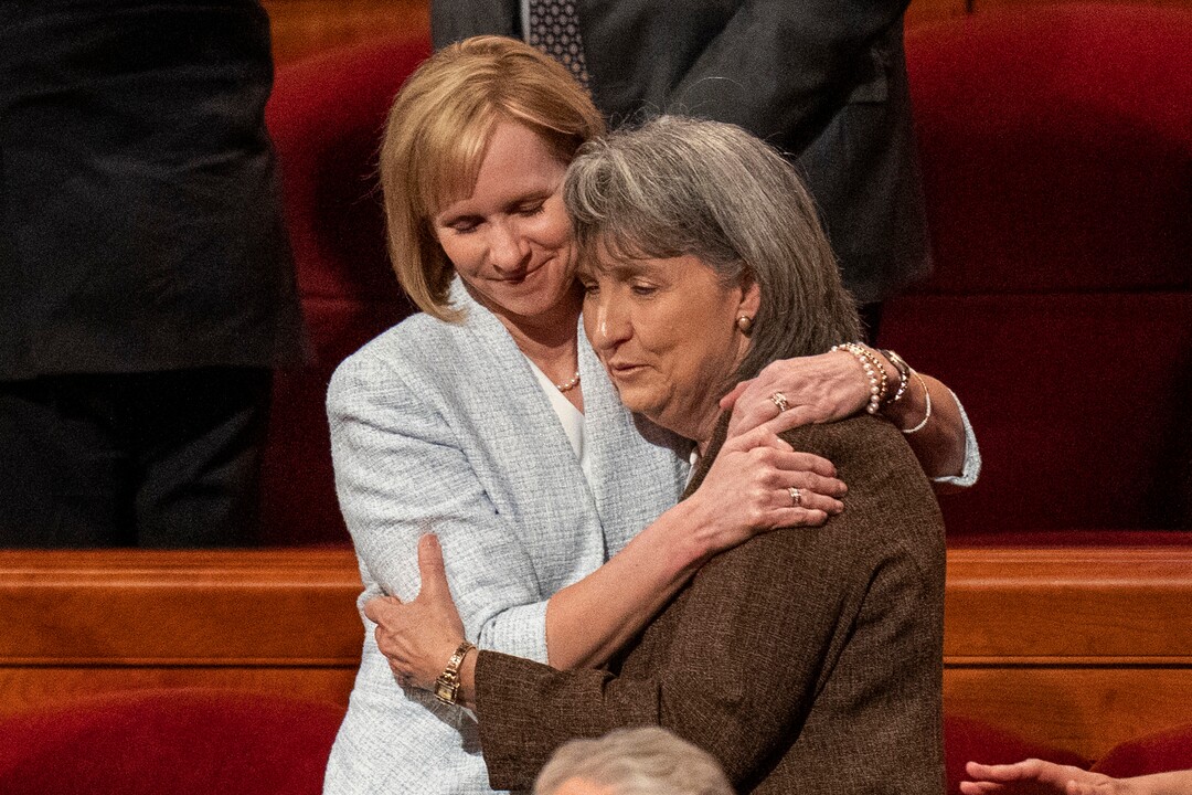 (Rick Egan | The Salt Lake Tribune) Newly called Primary general presidency First Counselor Amy Wright hugs Anette Dennis after the afternoon session of LDS General Conference on Saturday, April 2, 2022.

