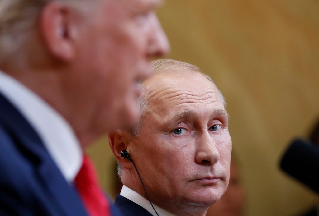 Russian President Vladimir Putin listens to U.S. President Donald Trump during a press conference after the meeting of U.S. President Donald Trump and Russian President Vladimir Putin at the Presidential Palace in Helsinki, Finland, Monday, July 16, 2018. (AP Photo/Pablo Martinez Monsivais)