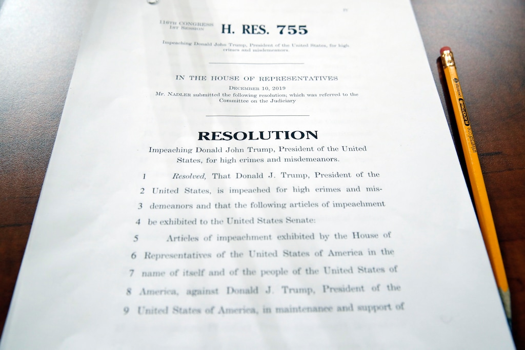 A copy of House Resolution 755 is on a desk for a House Judiciary Committee markup of the articles of impeachment against President Donald Trump, on Capitol Thursday, Dec. 12, 2019, in Washington. (AP Photo/Alex Brandon)
