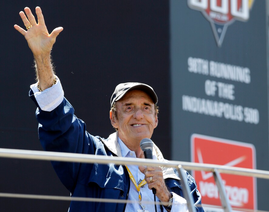 FILE - In this May 25, 2014 file photo, Jim Nabors waves to fans after singing before the start of the 98th running of the Indianapolis 500 IndyCar auto race at the Indianapolis Motor Speedway in Indianapolis. Nabors died peacefully at his home in Honolulu on Thursday with his husband Stan Cadwallader at his side. He was 87. (AP Photo/Michael Conroy, File)