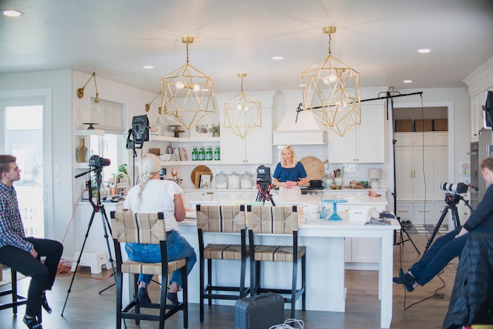 (Photo by Trina Harris Photography | Courtesy of Courtney Rich) Courtney Rich films one of her online cake classes in her kitchen in her Utah County home.