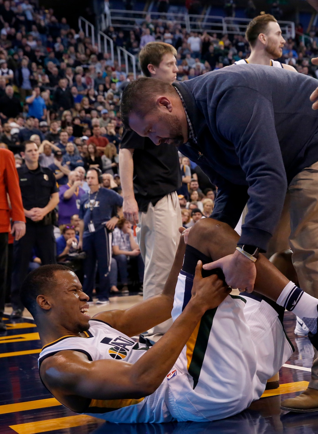 Utah Jazz's Rodney Hood lays on the ground after being injured in the second half during an NBA basketball game against the Orlando Magic Saturday, Jan. 14, 2017, in Salt Lake City. The Jazz won the game 114-107. (AP Photo/Kim Raff)