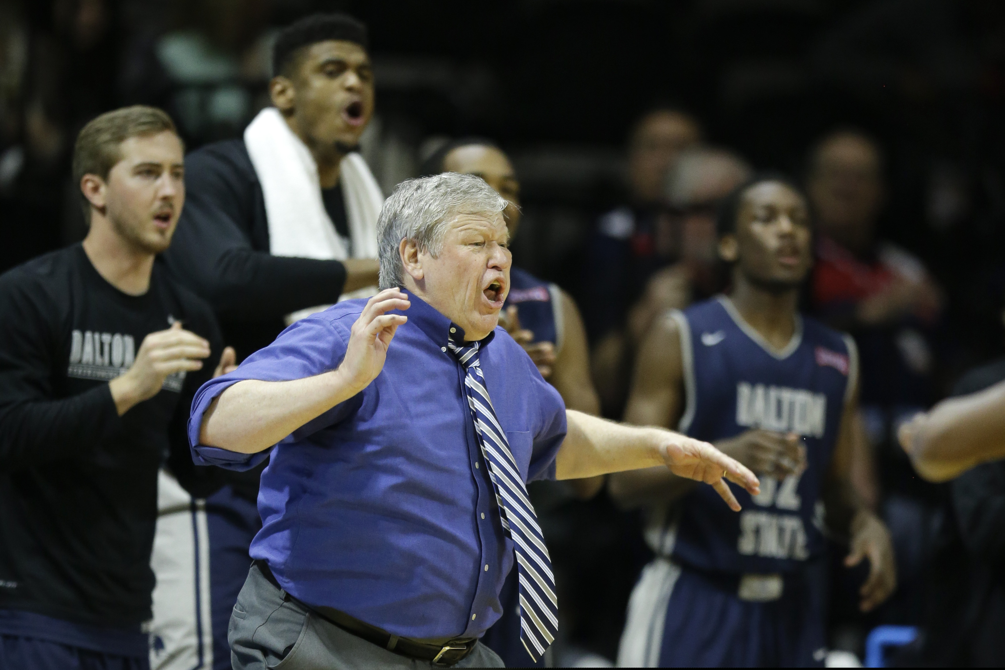 FILE - Dalton State coach Tony Ingle directs his team during the second half of the NAIA championship basketball game against Westmont in Kansas City, Mo., in this Tuesday, March 24, 2015, file photo. Dalton State defeated Westmont 71-53. Tony Ingle, who failed to win a game in his tenure as BYU's interim basketball coach but went on to capture lower-division national championships at two Georgia colleges, has died at the age of 68. His son, Izzy, announced on Twitter that Ingle died Monday night, Jan. 18, 2021, of complications from COVID-19.(AP Photo/Orlin Wagner, File)