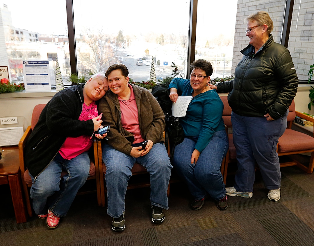Raylynn Marvel left, Patsy Carter, 2nd left, from Orem, Utah, Loreen Major 2nd right, and Arlene Arnold right, from Lehi, Utah wait in the offices of the Utah County Clerk and Auditor office for word if they will be issued a marriage license as a lesbian couple on July 20, 2013 in Provo, Utah. A Federal Judge on Friday struck down Utah's ban on same sex marriage saying the law violates the U.S. Constitution.  (Photo by George Frey  |  Special to the Tribune)