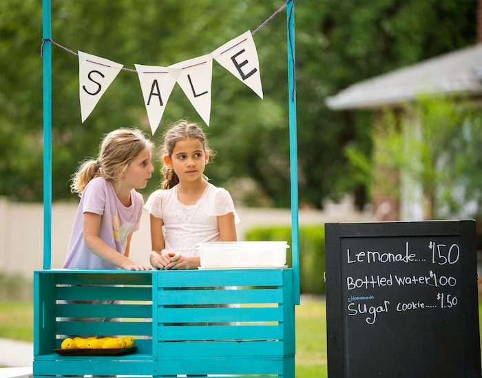(Rick Egan | The Salt Lake Tribune)  Lucy Haslam and Penelope Vasquez Pitcher sell lemonade at the Heart & Soul Music Stroll, in Sugar House, on Saturday, June 10, 2023.