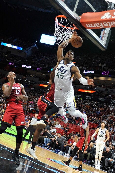 Utah Jazz guard Donovan Mitchell (45) goes up for a dunk against the Miami Heat during the first half of an NBA basketball game, Sunday, Dec 2, 2018, in Miami. (AP Photo/Gaston De Cardenas)