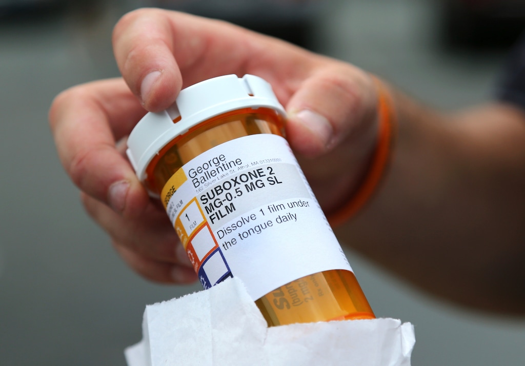 In this July 23, 2018, photo, newly-released inmate George Ballentine holds his prescription medicine Suboxone outside a pharmacy in Greenfield, Mass. While serving his sentence at the Franklin County Jail, Ballentine received a daily dose of buprenorphine (Suboxone) to control his heroin and opioid cravings. His doctor hopes to soon take him off the medication he'd been on for his last two months in jail. A Utah doctor was charged April 12, 2019, with unlawfully selling the pills. (AP Photo/Elise Amendola)