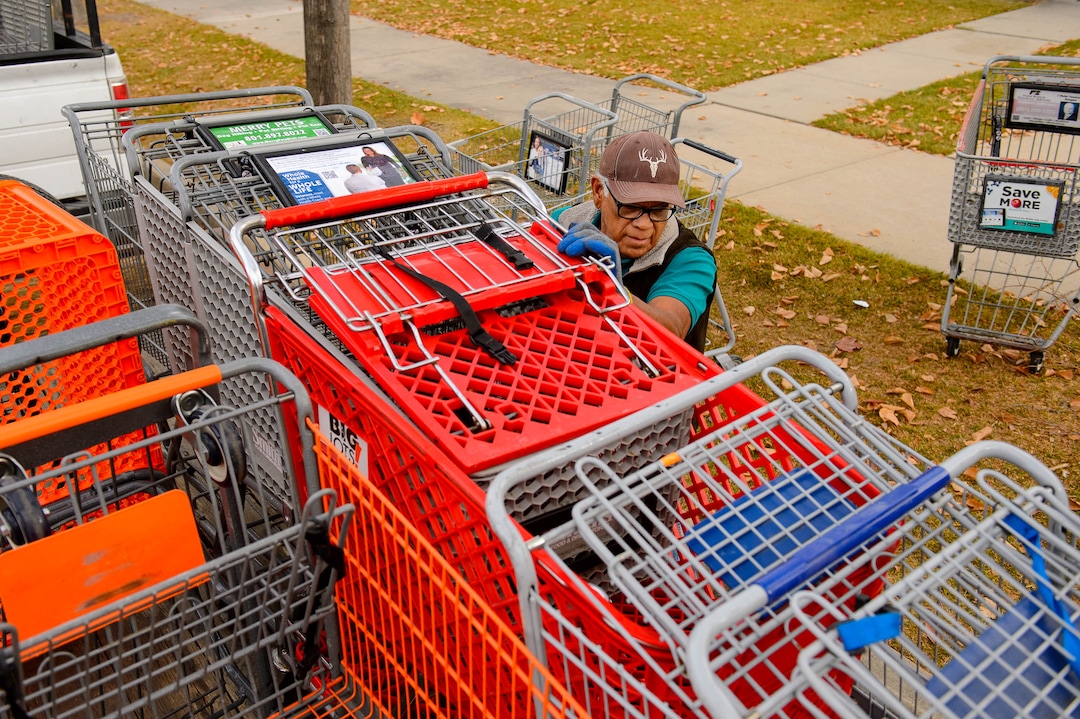 (Trent Nelson  |  The Salt Lake Tribune) Antonio Hernandez collects shopping carts in Salt Lake City on Tuesday, Nov. 19, 2019. Hernandez, an employee of Romac, is assigned to drive around the city and pick up stolen or abandoned shopping carts for return to stores.