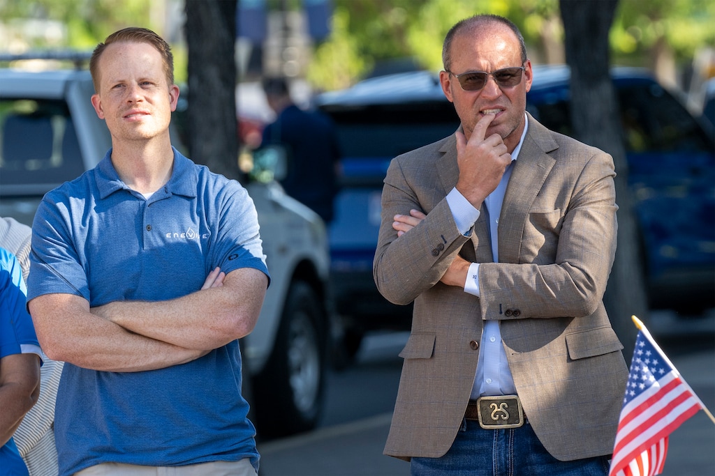 (Rick Egan | The Salt Lake Tribune) Rep. Trevor Lee, R-Layton, and House Speaker Mike Shultz, R-Hooper, gather with supporters of Kirk Moore at a rally on the steps of the Orrin G. Hatch Federal Courthouse in Salt Lake City on Monday, July 7, 2025. 
