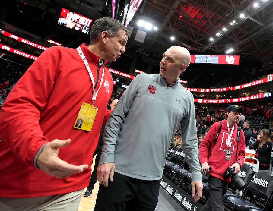(Leah Hogsten | The Salt Lake Tribune) University of Utah athletic director Mark Harlan and Utah Utes head coach Craig Smith walk off the court after the University of Utah lost to the TCU Horned Frogs at Vivint Arena, Dec. 21, 2022. 