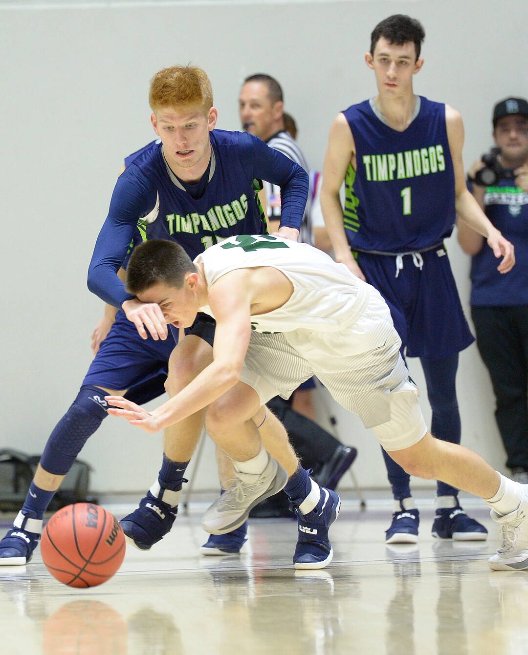 Leah Hogsten  |  The Salt Lake TribuneOlympus' Rylan Jones and Timpanogos' Tyler Walker fight for a loose ball.  Olympus High School defeated Timpanogos High School 91-69 during their 4A State boysÕ basketball quarterfinal playoff game at Weber State University's Dee Events Center, Thursday, March 2, 2017.