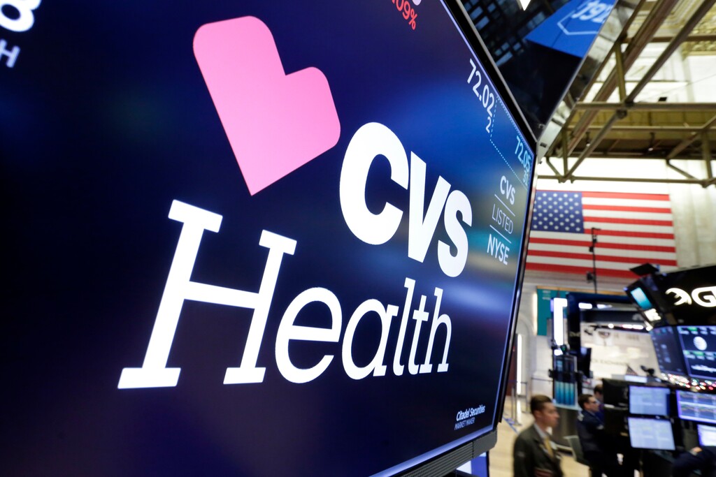 (Richard Drew | The Associated Press) In this Dec. 4, 2017, file photo, the CVS Health logo appears above a trading post on the floor of the New York Stock Exchange. Insurers are dropping billions of dollars on acquisitions and expansions as they get more involved in their customers’ health. Late last year, CVS Health announced a roughly $69 billion deal to buy another insurer, Aetna. Those companies plan to convert drugstores into health care hotspots that people can turn to for a variety of needs in between doctor visits.