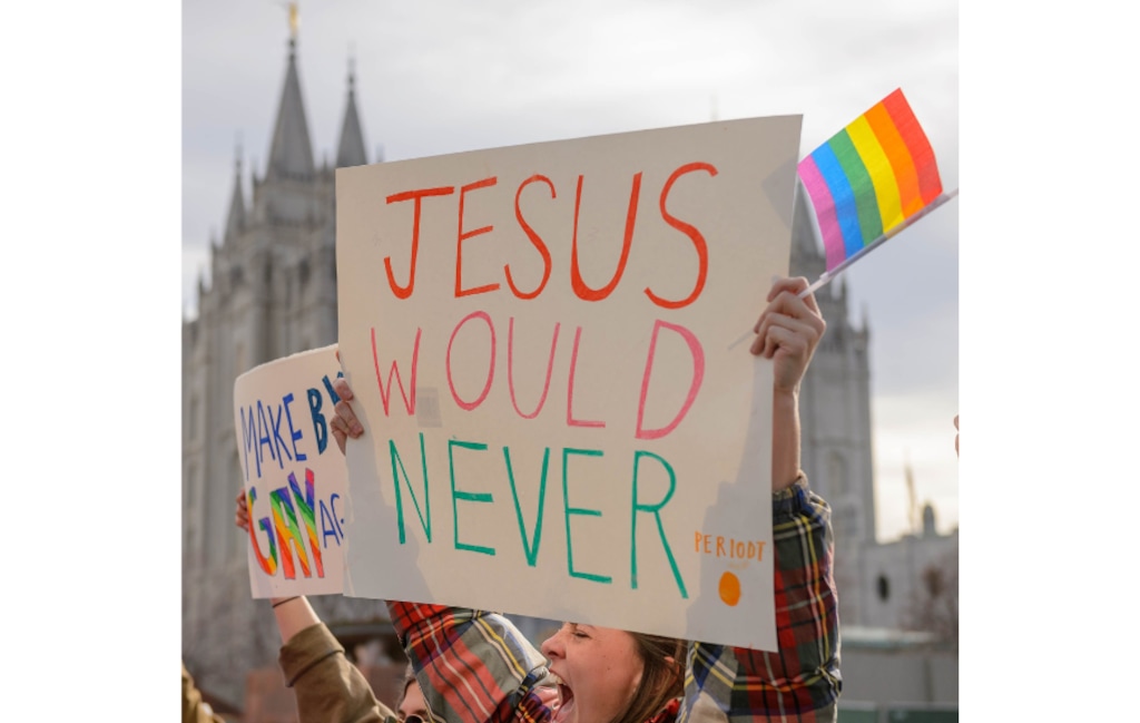 (Trent Nelson  |  The Salt Lake Tribune) Demonstrators march around the headquarters of The Church of Jesus Christ of Latter-day Saints protesting Brigham Young University’s position on "romantic behavior" by same-sex couples in 2020. A new poll shows increased support for LGBTQ protections among Latter-day Saints.