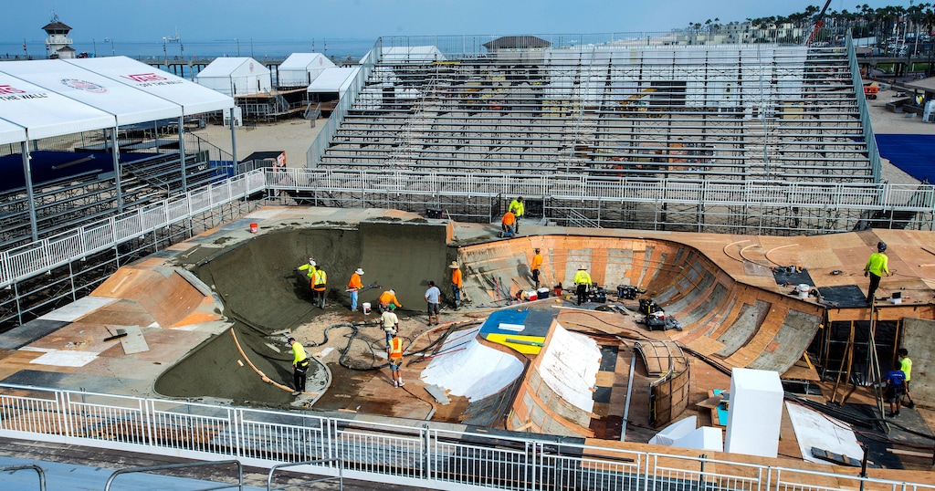 Workers construct a skate park on the beach just south of the Huntington Beach Pier in Huntington Beach, Calif., on Friday, July 21, 2017, for the upcoming Vans Park Series World Championship tour where the world's best men and women skateboarders will compete ahead of the VPS World Championships in Shanghai in September. A built-to-spec park will be built at the Utah State Fairpark for this September's event. (Mark Rightmire/The Orange County Register via AP)