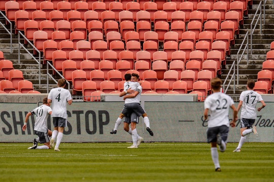 (Trent Nelson  |  The Salt Lake Tribune)  Olympus's Din Huremovic (11) embraces Olympus's Logan Davies (2), celebrating a goal in the first half as Olympus faces Brighton High School in the 5A boys state championship game at Rio Tinto Stadium in Sandy, Thursday May 23, 2019.