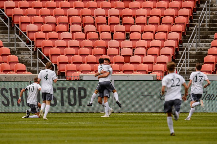 (Trent Nelson  |  The Salt Lake Tribune)  
Olympus's Din Huremovic (11) embraces Olympus's Logan Davies (2), celebrating a goal in the first half as Olympus faces Brighton High School in the 5A boys state championship game at Rio Tinto Stadium in Sandy, Thursday May 23, 2019.