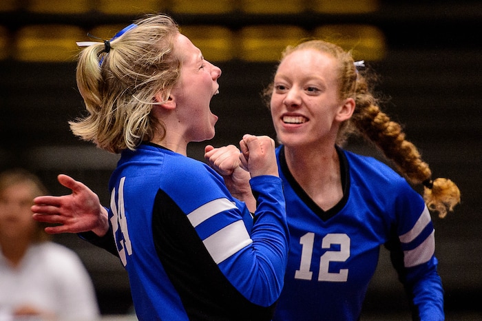 (Trent Nelson | The Salt Lake Tribune) Panguitch's Abbey Blevins and Panguitch's Taylia Norris celebrate a point as Panguitch defeats Rich in the 1A State Volleyball Championship game in Orem, Saturday October 28, 2017.