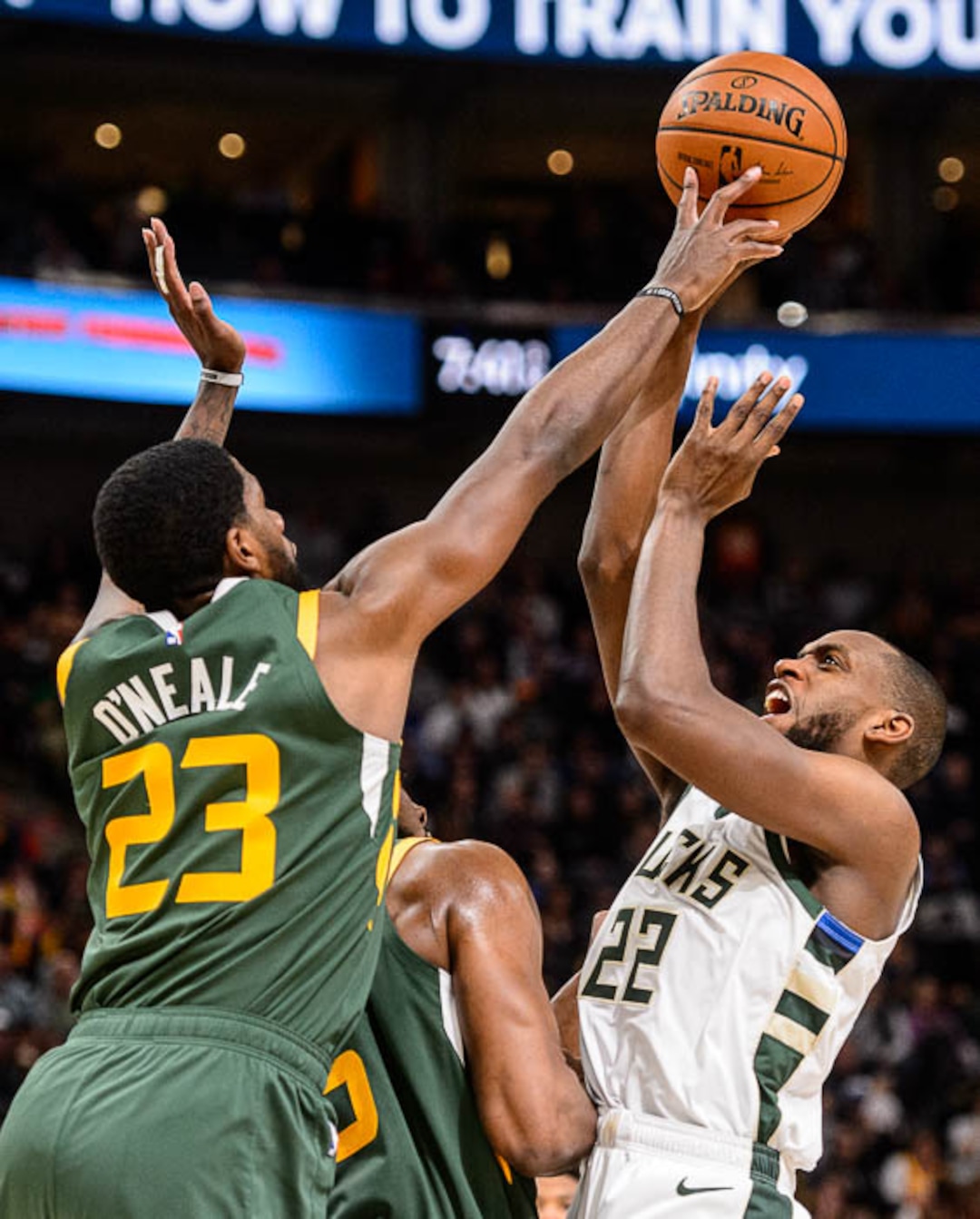 (Trent Nelson | The Salt Lake Tribune)  Utah Jazz forward Royce O'Neale (23) defending a shot by Milwaukee Bucks forward Khris Middleton (22) as the Utah Jazz host the Milwaukee Bucks, NBA basketball in Salt Lake City on Saturday March 2, 2019.