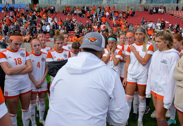 (Chris Samuels | The Salt Lake Tribune) Skyridge coach Toby Peterson consoles his players after Riverton wins the 6A girls’ soccer state championships 3-1 at Rio Tinto Stadium in Sandy, Friday, Oct. 22, 2021.