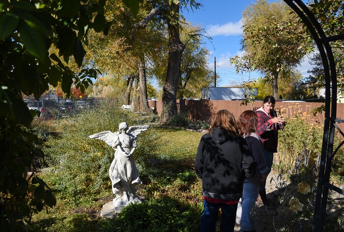 (Francisco Kjolseth  |  The Salt Lake Tribune)  The Center for Women and Children which was forced to close in 2014 when government grants ran out is once again taking women and their children as they go through adult detox programs. Celia Bell, at right, a horticulture education specialist who maintained the Freedom Garden across the street, gives women a tour of the Reflection Garden recently and welcomes them to participate and grow fruits and vegetables as part of their rehabilitation.