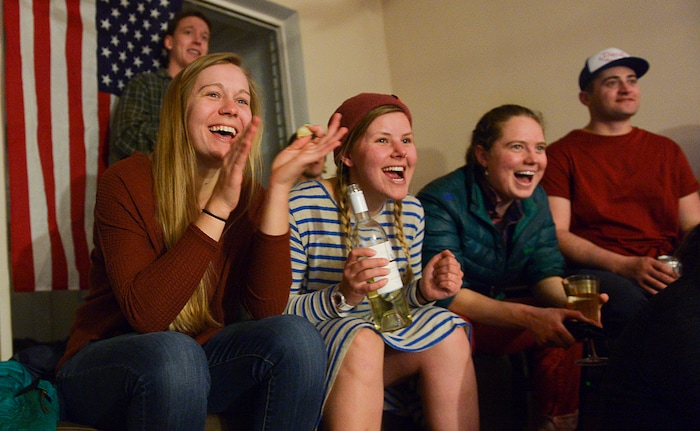(Leah Hogsten | The Salt Lake Tribune) l-r Zoe Zeerip, Zoey Gray and Emilia Went cheer on Darian Stevens. Westminster students and friends of first-time Olympian Darian Stevens gathered for a watch party in Sugar House to watch Stevens compete in her first qualifying ski slopestyle competition run Friday, Feb. 16, 2018. Stevens is a graduate of the Park City Winter Sports School and a business major at Westminster.