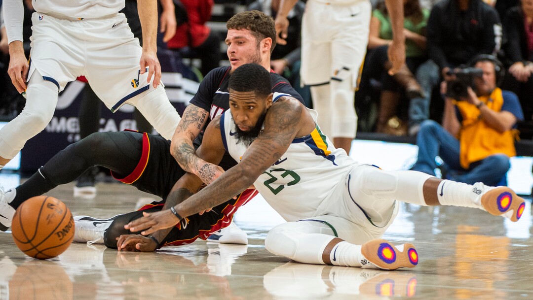(Rick Egan  |  The Salt Lake Tribune)     Miami Heat guard Tyler Johnson (8) and Utah Jazz forward Royce O'Neale (23) go for a loose ball, in NBA action between Utah Jazz and Miami Heat, at Viint Smart Home Arena Wednesday, Dec. 12, 2018.