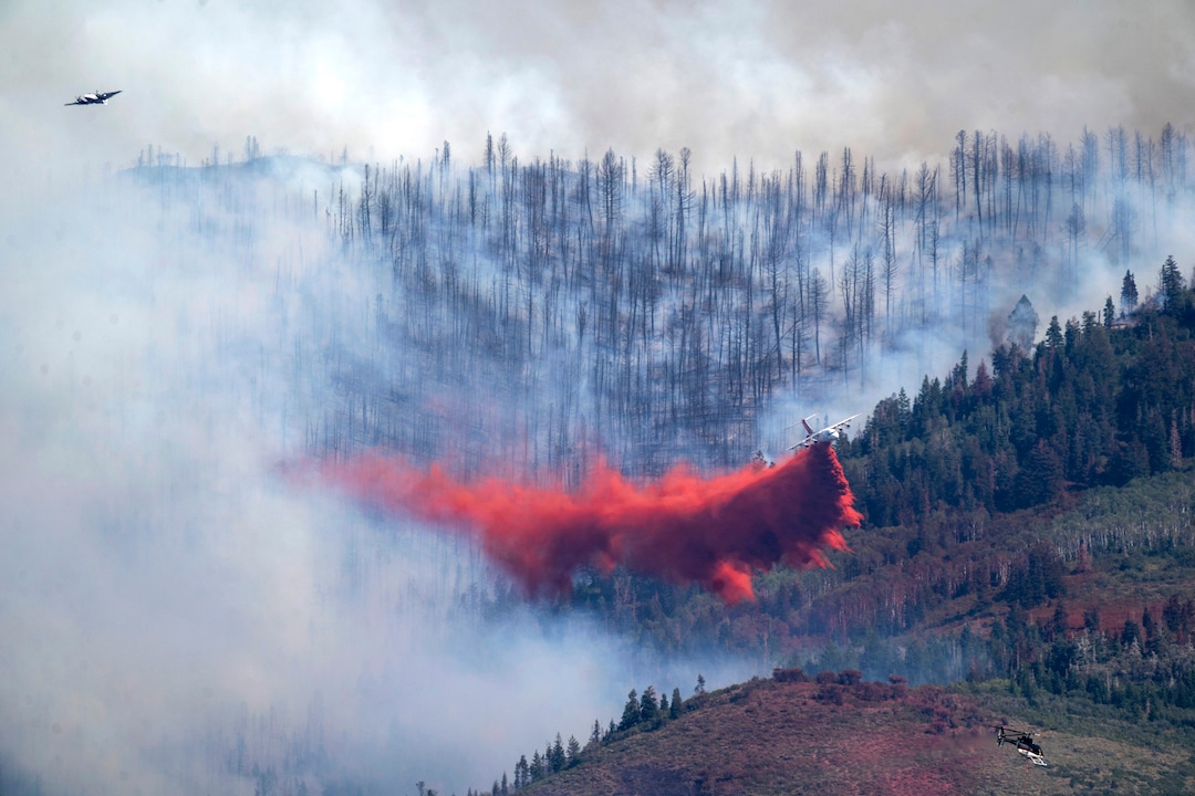 (Rick Egan | The Salt Lake Tribune) Two planes and helicopter work on the fire in Parleys Canyon, on Saturday, Aug. 14, 2021.