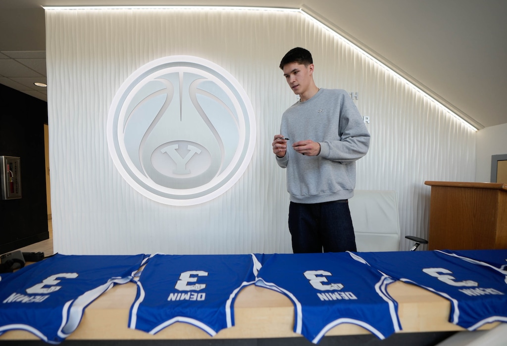 (Francisco Kjolseth | The Salt Lake Tribune) BYU basketball player Egor Demin, signs a few jerseys for a Russian organization called God Ball, after announcing his plans to enter the NBA Draft, where he would likely be a first-round pick in June, during a news event in Provo on Tuesday, April 8, 2025.