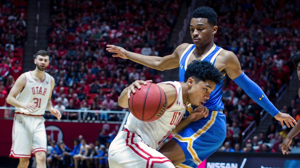 Utah guard Sedrick Barefield (2) is guarded by UCLA guard Jaylen Hands (4) in the second half of an NCAA college basketball game Saturday, March 9, 2019, in Salt Lake City. (AP Photo/Tyler Tate)