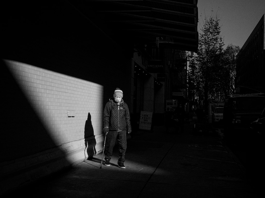 (Ashley Gilbertson | The New York Times)
A pedestrian in Manhattan's NoLita neighborhood, Dec. 10, 2020. "As Americans' hostility toward one another seems to be growing, their care for one another seems to be falling," writes The New York Times columnist David Brooks. "This is what it feels like to live in a society that is dissolving from the bottom up as much as from the top down."