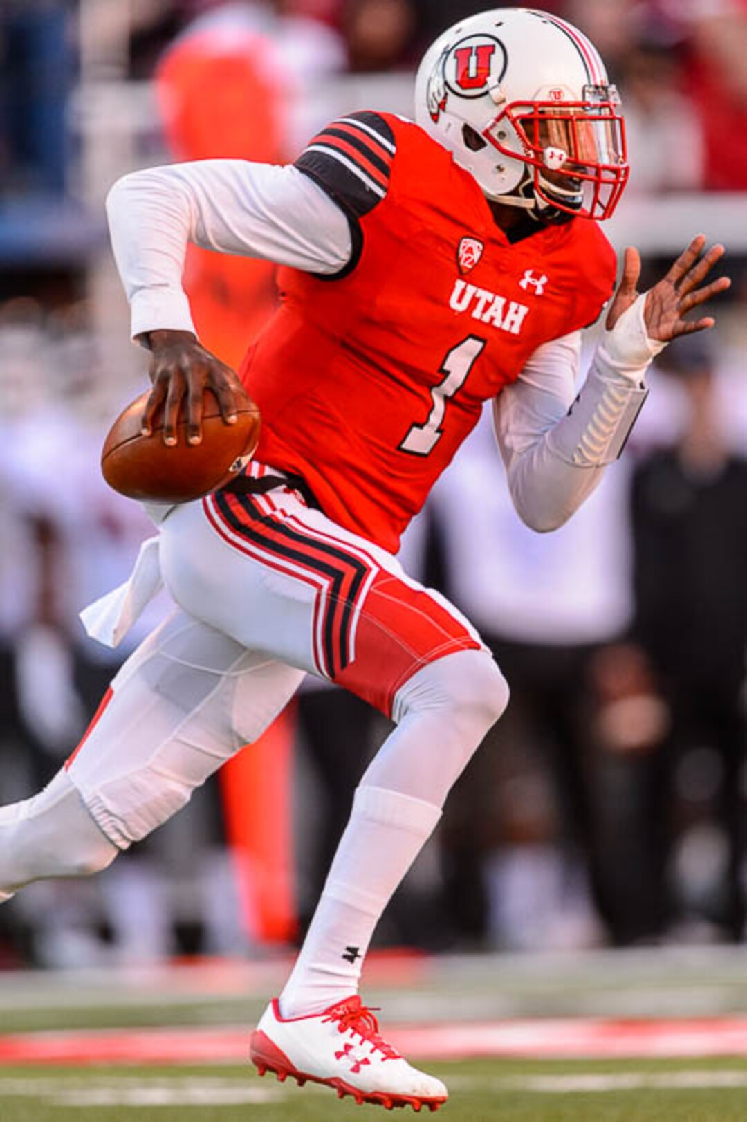 (Trent Nelson | The Salt Lake Tribune)  Utah Utes quarterback Tyler Huntley (1) runs with the ball as the University of Utah hosts Washington State, NCAA football in Salt Lake City, Saturday November 11, 2017.