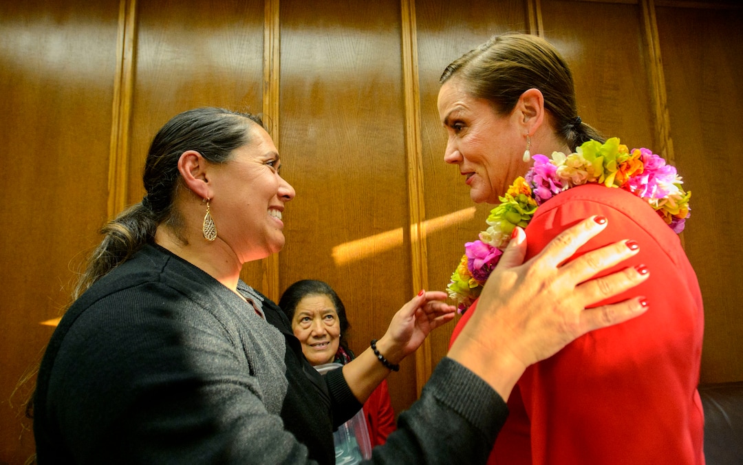 (Steve Griffin  |  The Salt Lake Tribune) Ofa Kaufusi places a fresh flower lei on the shoulders of her sister-in-law, Michelle Kaufusi, prior to Michelle being sworn into office as the first female mayor in Provo city's history. The small private ceremony was held in the Mayor's Office in Provo Tuesday January 2, 2018.  A public Inauguration Ceremony for Mayor Kaufusi will be held at the Provo Library on January 18, 2018.