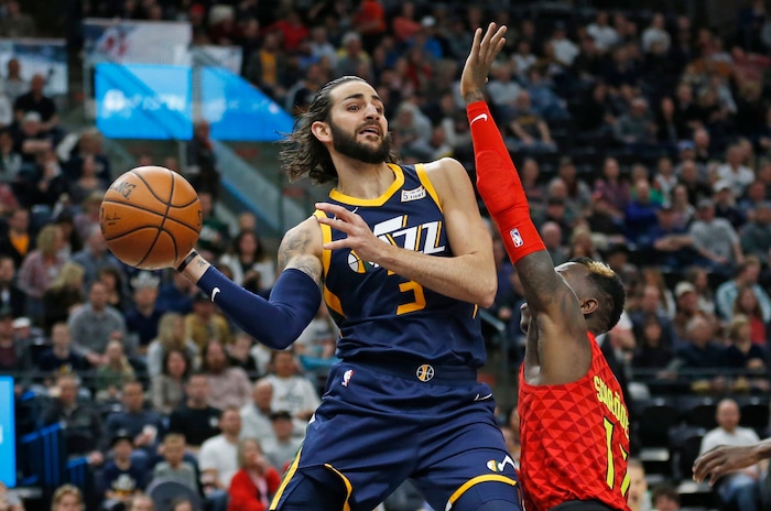 Utah Jazz guard Ricky Rubio (3) passes the ball as Atlanta Hawks guard Dennis Schroder (17) defends in the first half during an NBA basketball game Tuesday, March 20, 2018, in Salt Lake City. (AP Photo/Rick Bowmer)