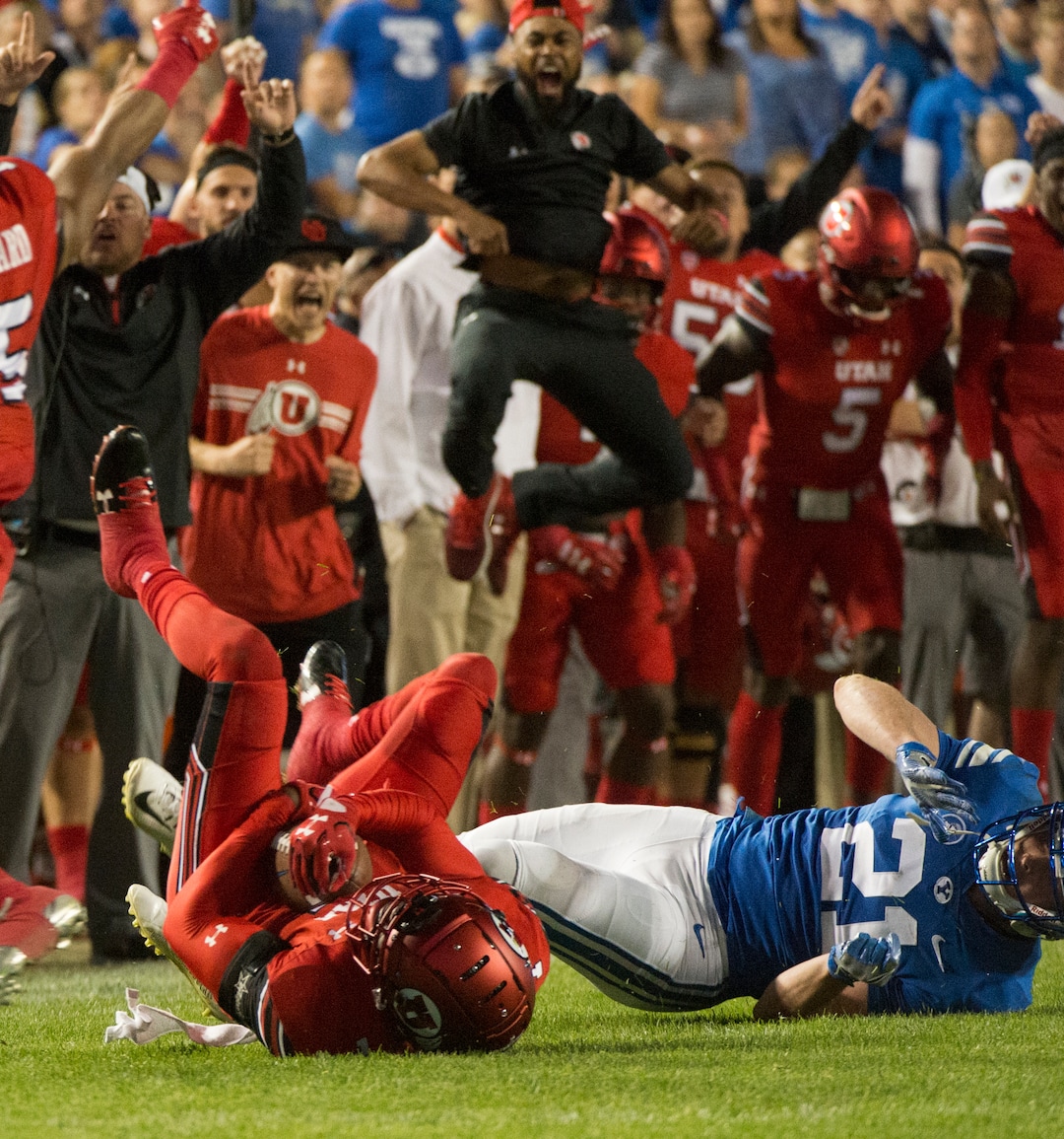 (Rick Egan  |  The Salt Lake Tribune)  The Utah bench celebrates as Ute  defensive back Jaylon Johnson (7) intercepts a pass intended for Brigham Young Cougars wide receiver Talon Shumway (21), in football action BYU vs Utah, at Lavell Edwards Stadium in Provo, Saturday, September 9, 2017.