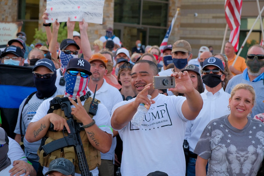 (Leah Hogsten  |  The Salt Lake Tribune) Supporters for Blue Lives Matter and the Cottonwood Heights Police Department pose for a group photo. Five days after after nine protesters were arrested during a peaceful rally in memory of Zane James that turned into a violent clash with Cottonwood Heights officers, demonstrators gathered outside the police station Friday to denounce CHPD's actions and its officers for inciting the violence.