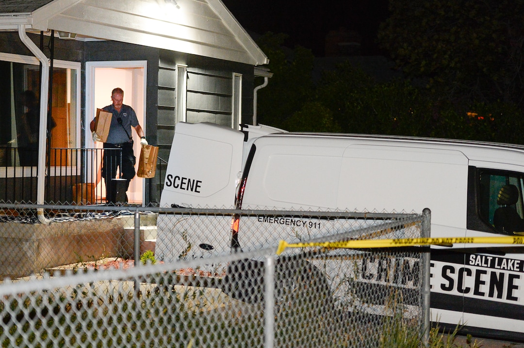 (Francisco Kjolseth  |  The Salt Lake Tribune)  Police investigators remove multiple bags of evidence during their search of a home at 547 N. 1000 West in Salt Lake City as part of the disappearance of University of Utah student MacKenzie Lueck that carried on into the early morning hours of Thursday, June 27, 2019.