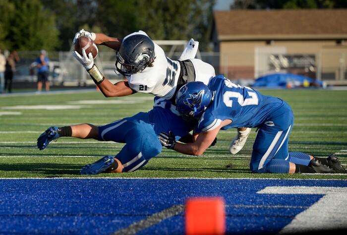 (Scott Sommerdorf | The Salt Lake Tribune) Corner Canyon RB Tai Gonzales gets the ball to the one yard line to set up QB Zach Wilson's first half TD run. Corner Canyon led Pleasant Grove 14-3 at the half, Friday, August 18, 2017.