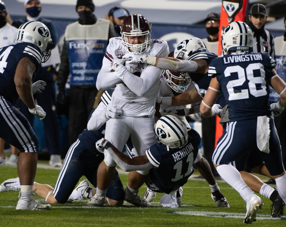 (Francisco Kjolseth  |  The Salt Lake Tribune) Texas State Bobcats tight end Jackson Lanam (87) is mobbed by the BYU defense during an NCAA college football game at LavVell Edwards Stadium, Saturday, oct. 24, 2020, in Provo, Utah.