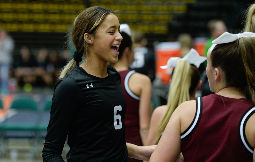 (Francisco Kjolseth  |  The Salt Lake Tribune)  Tasia Farmer of Lone Peak teammates celebrates with fellow students following their game against Fremont in their quarterfinal match at the UCCU Center at Utah Valley University on Thursday, Nov. 2, 2017. Lone Peak went on to beat Fremont in three straight sets.
