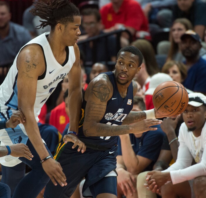 (Rick Egan  |  The Salt Lake Tribune)      Utah Jazz guard Kendrick Ray (17) tosses a pass, as Memphis Grizzlies center Deyonta Davis (21) defends,in Utah Jazz summer league action between Utah Jazz and Memphis Grizzlies in Salt Lake City, Tuesday, July 3, 2018.