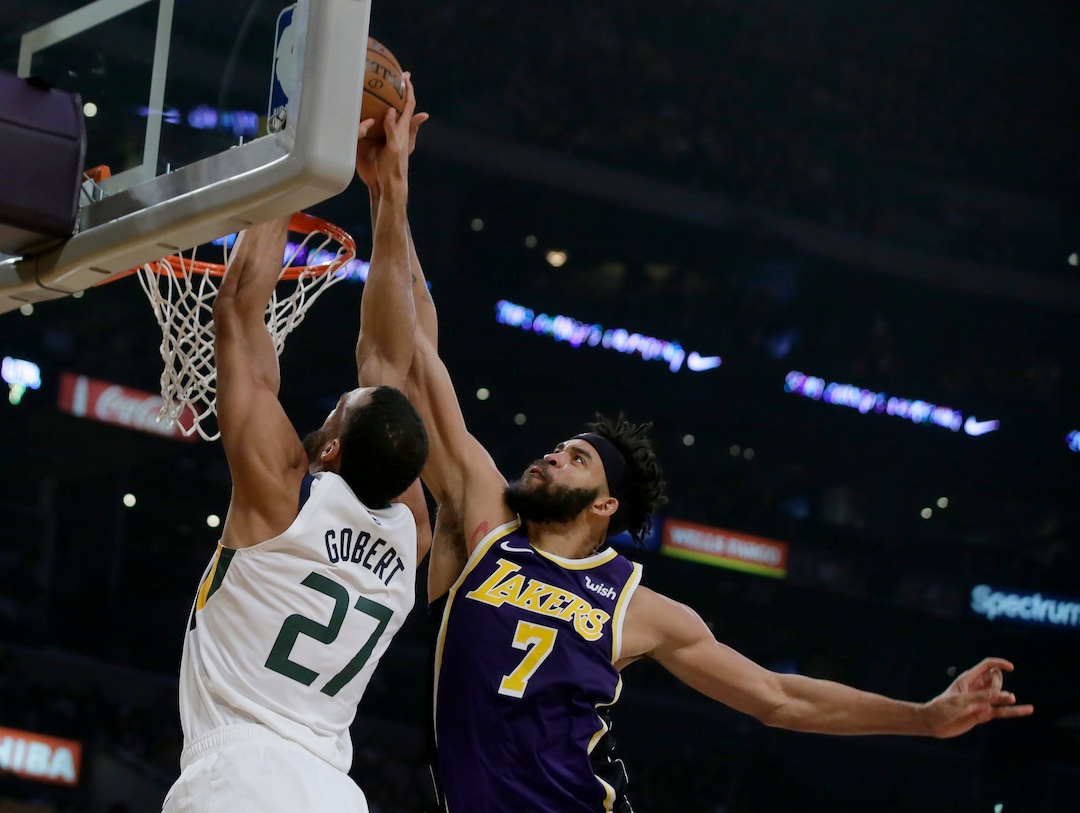 Los Angeles Lakers center JaVale McGee, right, blocks a shot by Utah Jazz center Rudy Gobert during the first half of an NBA basketball game in Los Angeles, Friday, Oct. 25, 2019. (AP Photo/Alex Gallardo)