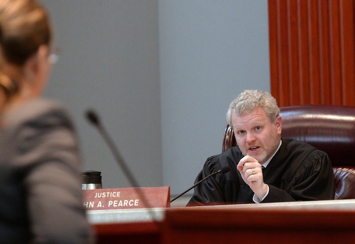 (Al Hartmann  |  The Salt Lake Tribune) 	
Utah Supreme Court Justice John Pearce questions federal public defender Charlotte Merrill, left, as she argues before the Utah Supreme Court Wednesday Jan. 10. The court heard arguments regarding Anthony Michael Archuleta, 55, who has been on death row since his conviction in 1989 for the Nov. 21, 1988, torture slaying of Gordon Ray Church, a 28-year-old Southern Utah State College theater student, at a remote location in Millard County. In separate trials, Archuleta and co-defendant Lance Conway Wood each were convicted of capital murder. Wood was sentenced to life in prison. Archuleta was sentenced to death. 