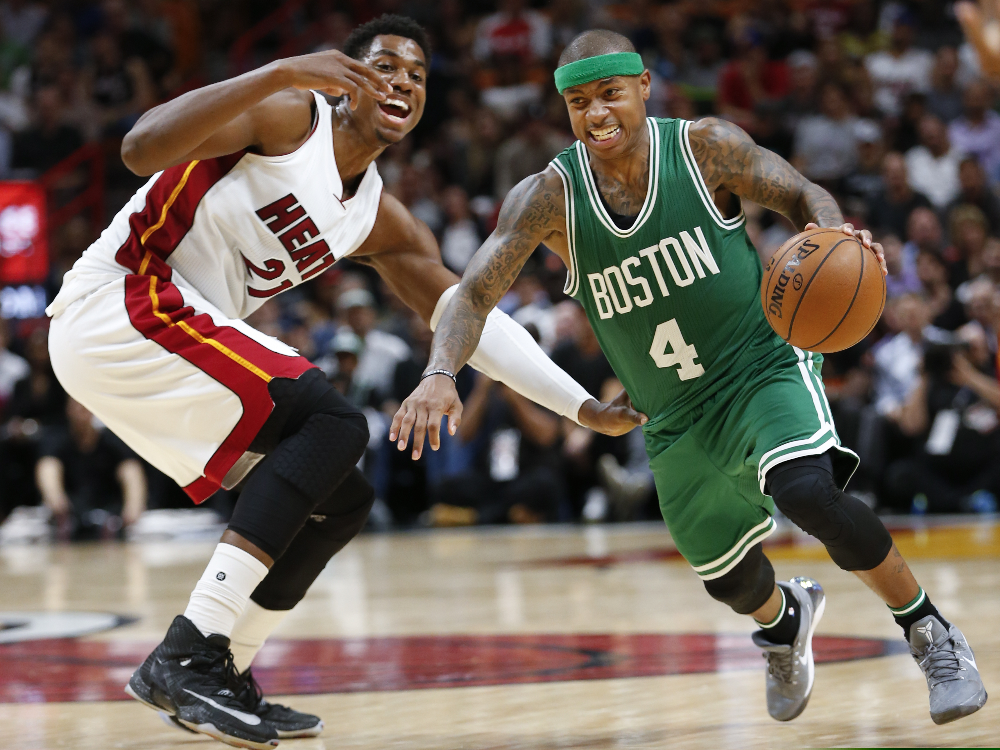 FILE - Boston Celtics guard Isaiah Thomas (4) drives to the basket past Miami Heat center Hassan Whiteside (21) during the second half of an NBA basketball game in Miami, in this Nov. 28, 2016, file photo. Two-time NBA All-Star Isaiah Thomas hopes playing this weekend with USA Basketball in FIBA AmeriCup qualifying in Puerto Rico gives an NBA club reason to sign him.. (AP Photo/Wilfredo Lee)