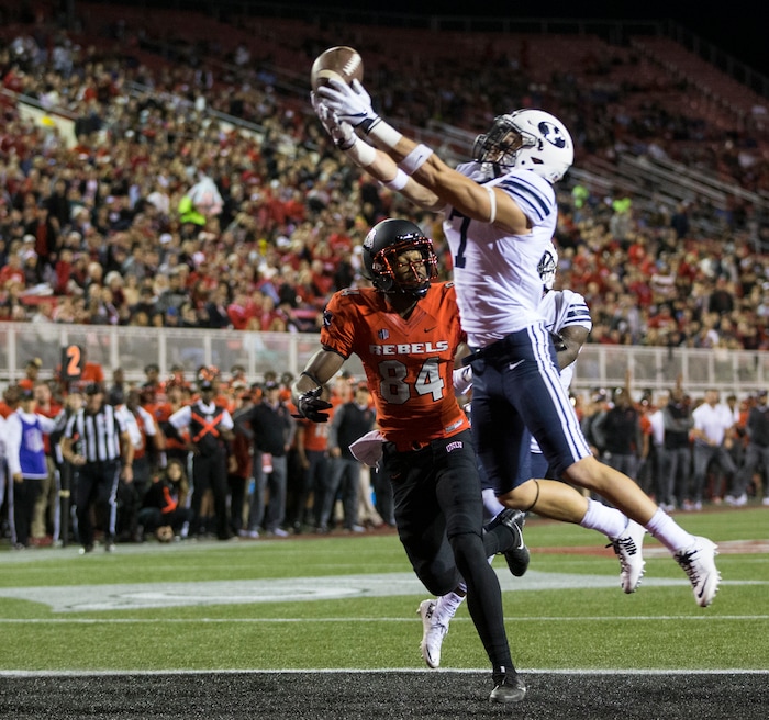 BYU defensive back Micah Hannemann (7) is unable to make an interception against UNLV wide receiver Kendal Keys (84) during an NCAA college football game Friday, Nov. 10, 2017, in Las Vegas. (Erik Verduzco/Las Vegas Review-Journal via AP)