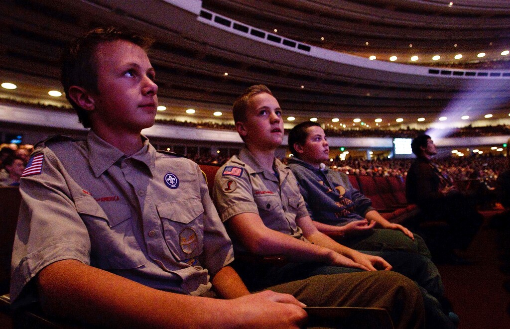 (Leah Hogsten  |  Tribune File Photo)  l-r Cameron Askelson, Garrett Allan and Justin Ackley from Troop 1119 in Highland watch "A Century of Honor," commemorating the 100-year partnership between the LDS Church and the Boy Scouts of America, Tuesday, Oct. 29, 2014, at the Conference Center in Salt Lake City