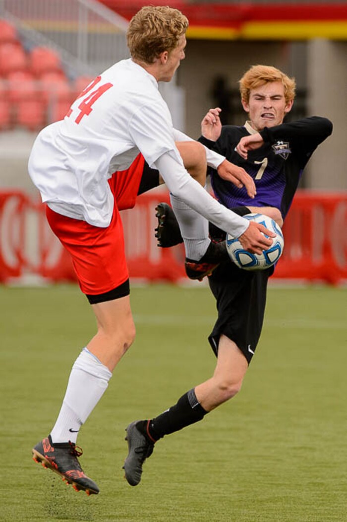 (Trent Nelson | The Salt Lake Tribune)  Desert Hills vs. Park City High School, Saturday May 12, 2018. Park City's Andre Hoglin and Desert Hills's Jake Barton.