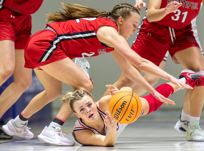 (Rick Egan | The Salt Lake Tribune) Springville Red Devil guard Ellie Esplin (1) gets rid of the ball, as Bountiful Redhawks Ellyse Kessler (12) defends, in the Girls 5A State Championship between the Springville Red Devils and the Bountiful Redhawks, at Weber State, on Saturday, March 4, 2023.
