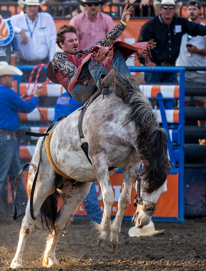 (Rick Egan | The Salt Lake Tribune) Dean Thompson, from Altamont, Utah, competes in the bareback riding competition at the Utah Days of '47 Rodeo at the State Fairpark, on Monday, July 25, 2022.