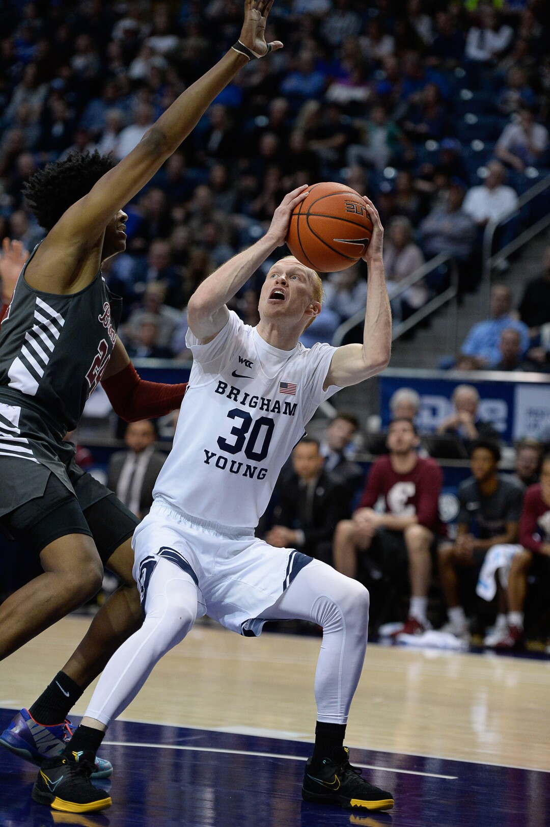 (Francisco Kjolseth  |  The Salt Lake Tribune) Brigham Young Cougars guard TJ Haws (30) looks for an opening past Santa Clara Broncos guard Jalen Williams (24) in the first half as the Brigham Young Cougars host the Santa Clara Broncos at the Marriott Center in Provo, Thursday, Feb. 20, 2020.